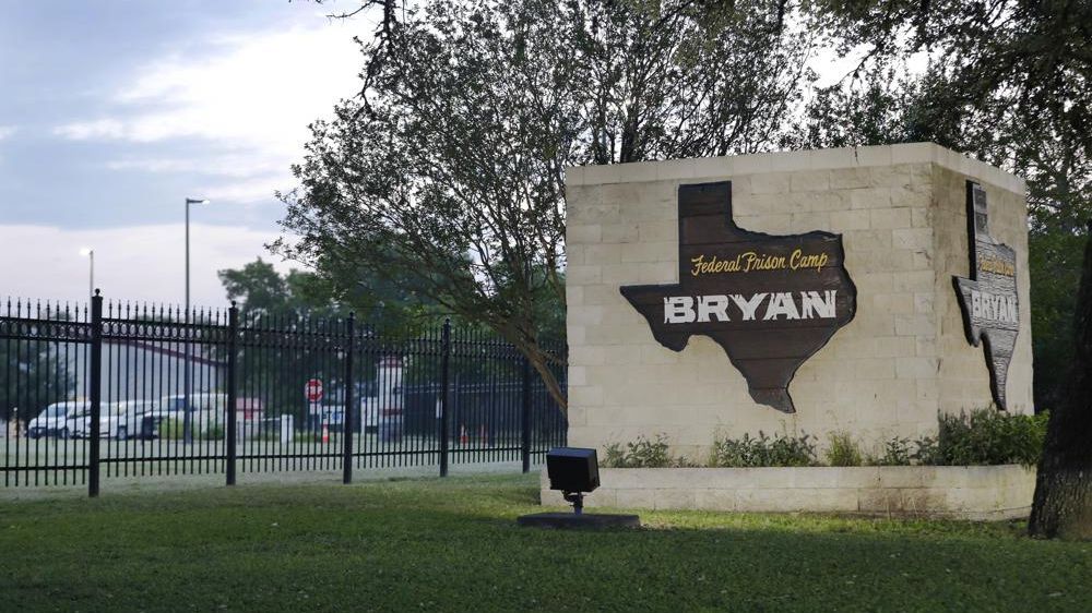 Dawn breaks at the Federal Prison Camp where Elizabeth Holmes, the former founder and CEO of Theranos, is expected to arrive to begin her 11 year sentence for fraud relating to the defunct company Tuesday, May 30, 2023, in Bryan, Texas. (AP Photo/Michael Wyke)