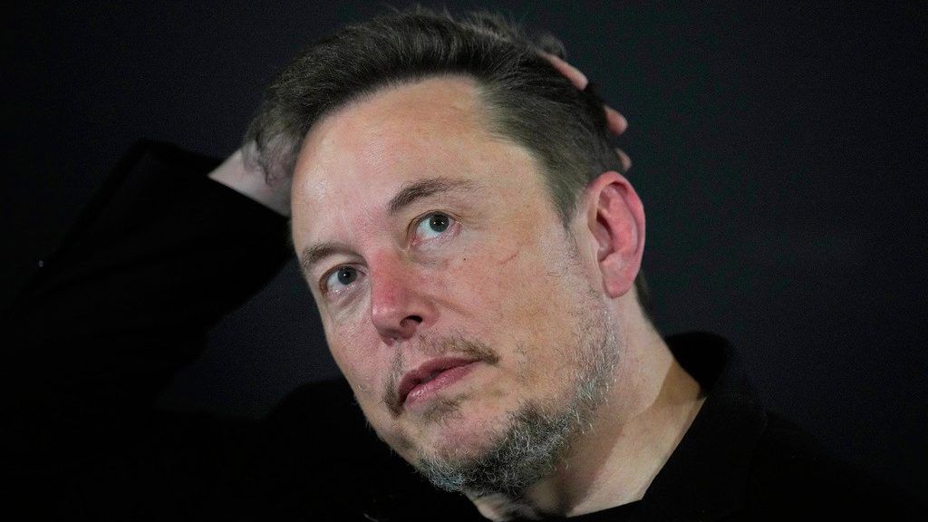 Elon Musk reacts during an in-conversation event with Britain's Prime Minister Rishi Sunak in London, on Nov. 2, 2023. (AP Photo/Kirsty Wigglesworth, Pool, File)