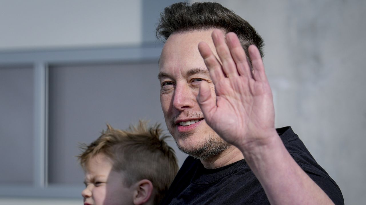 Tesla CEO Elon Musk waves as he leaves the Tesla Gigafactory for electric cars after a visit in Gruenheide near Berlin, Germany, March 13, 2024. (AP Photo/Ebrahim Noroozi, File)