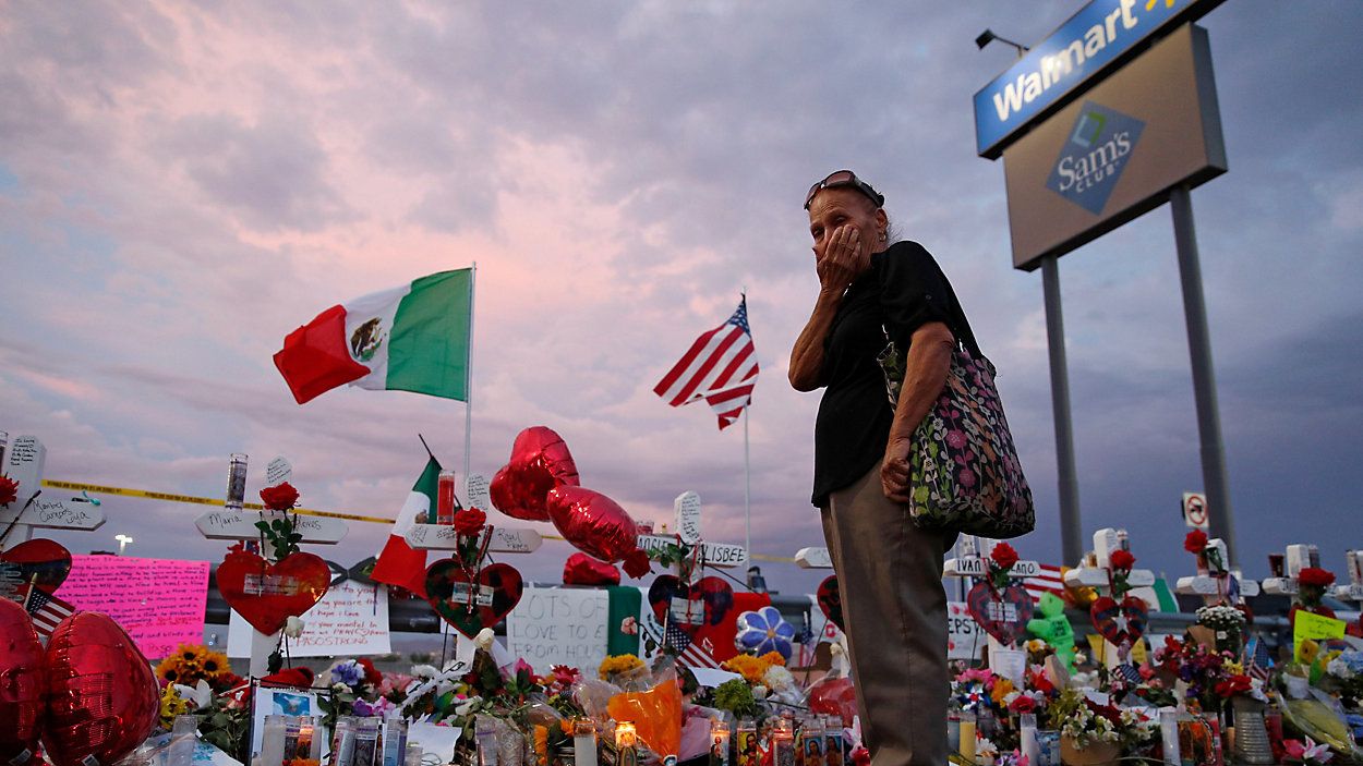 A woman stands near a memorial for the victims of the Aug. 3, 2019, mass shooting in El Paso, Texas.  (AP Photo/John Locher, File)