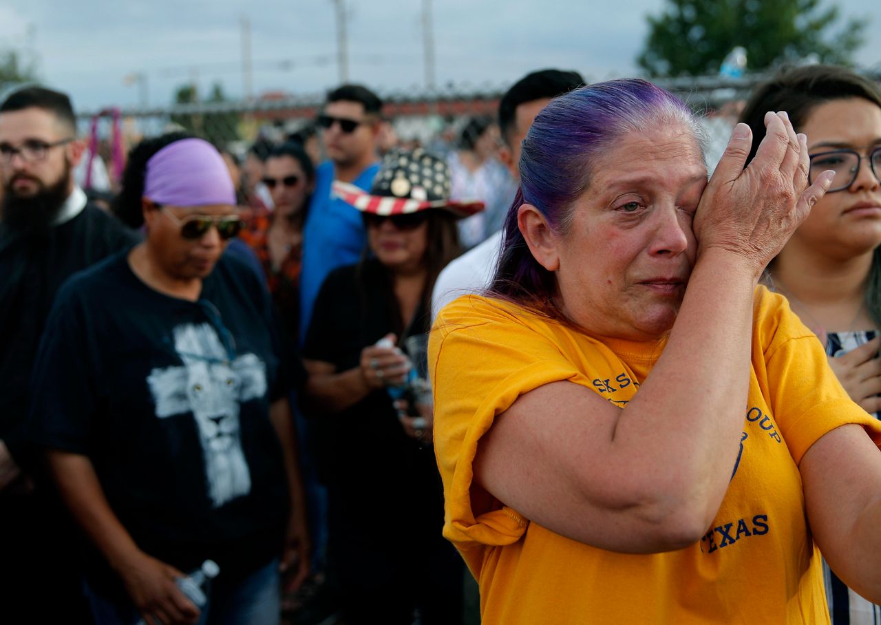 Cathe Hill wipes tears from her eyes during a vigil for victims of the Aug. 3, 2019, mass shooting at an El Paso-area Walmart. (AP Photo/John Locher)
