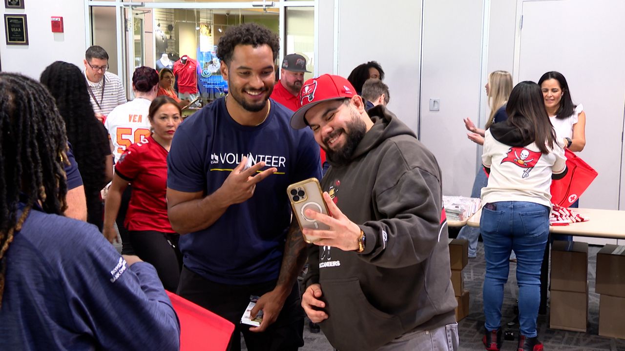 Emeka Egbuka volunteers at USAA's 'Huddle Up for Hurricane Prep' event