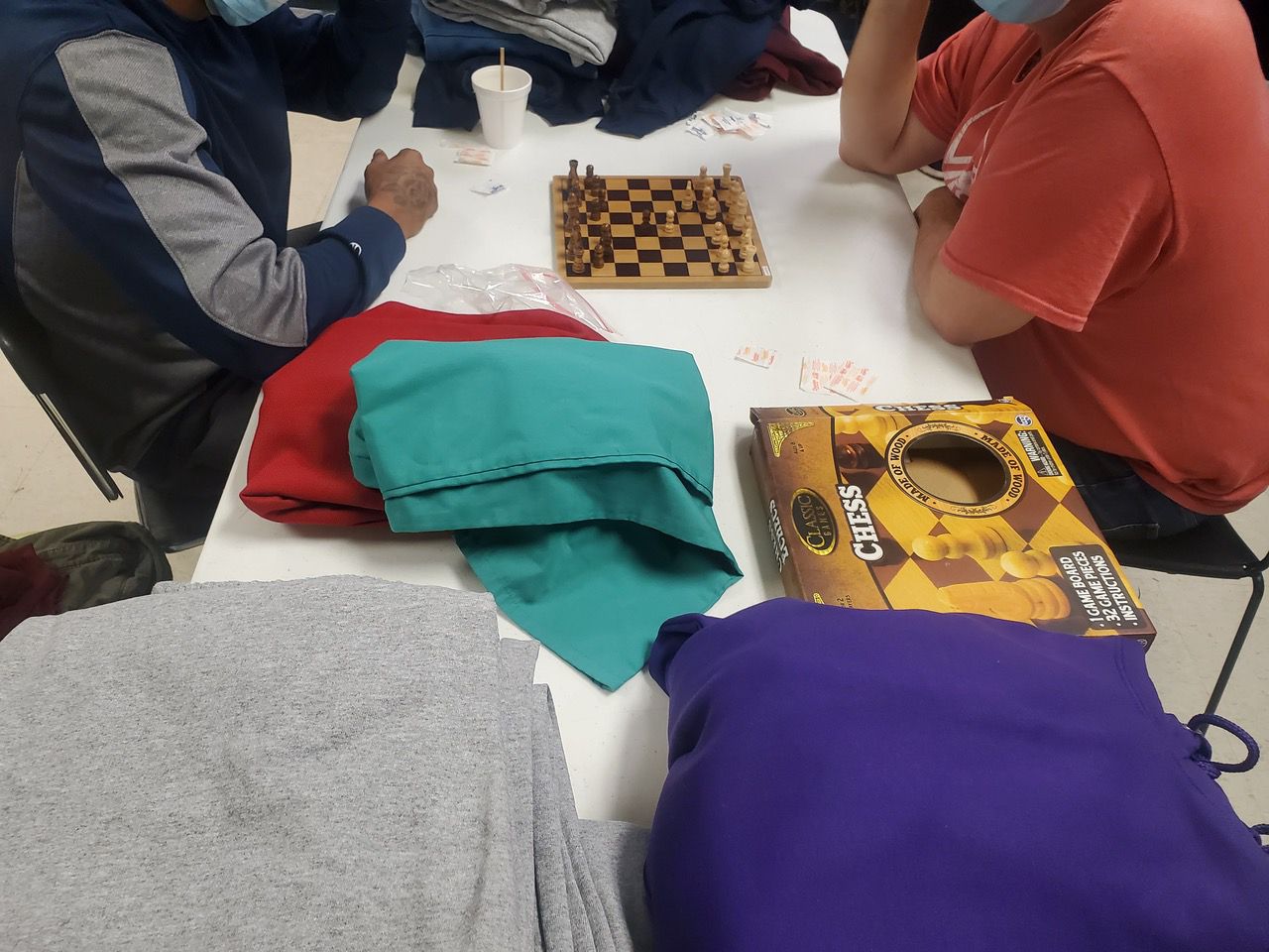 Guests at the Emergency Shelter of Northern Kentucky play a game of chess during an overnight stay. (Provided)
