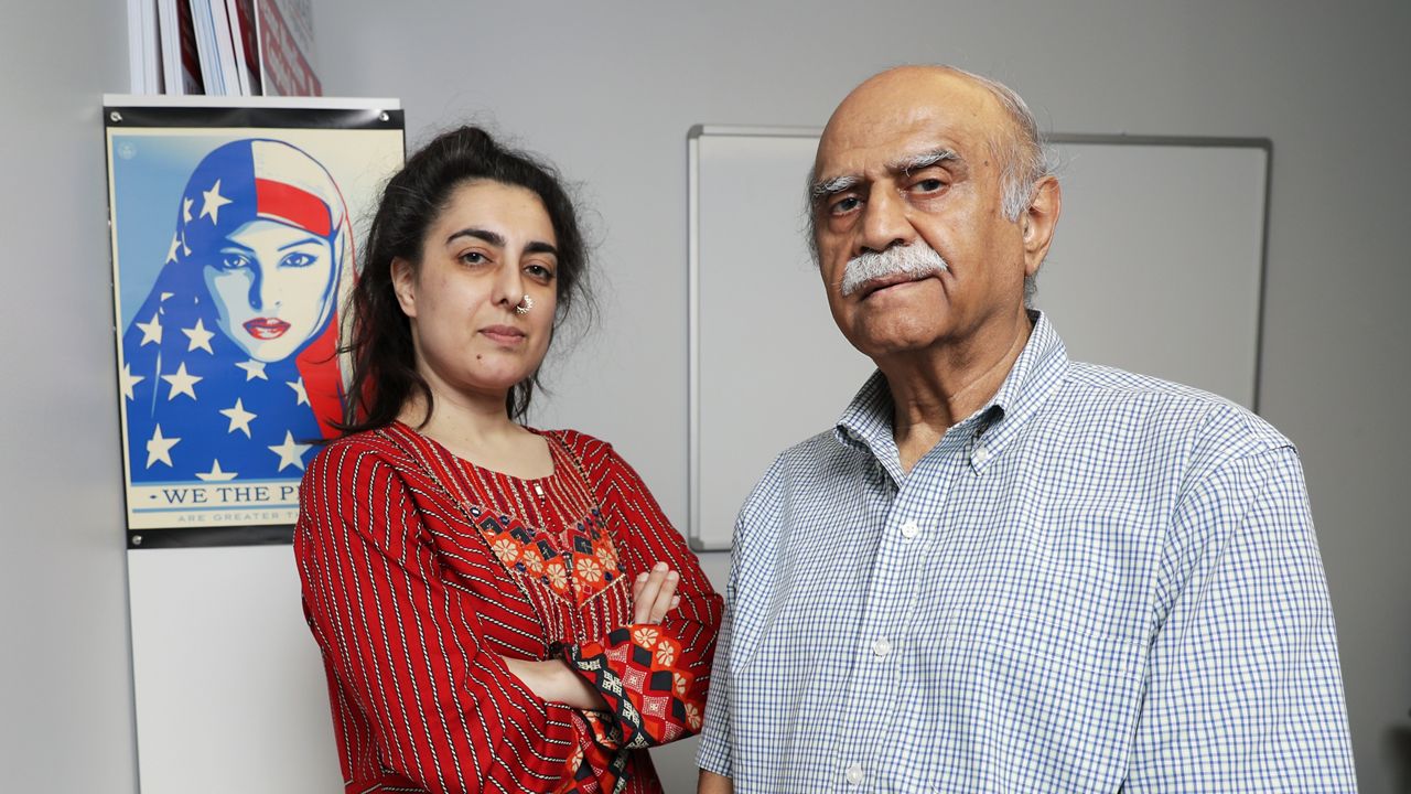 Palwasha Sharwani, executive director of Emgage Texas, left, and A.J. Durrani, right, a Harris County elections judge, pose for a photo on Wednesday, July 26, 2023, in Houston. (AP Photo/Michael Wyke)