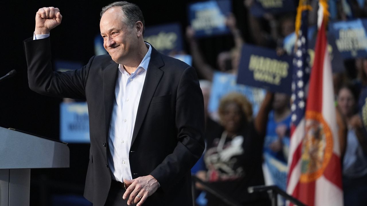 Second gentleman Doug Emhoff salutes the crowd after speaking in support of his wife, Democratic presidential nominee Vice President Kamala Harris, at a Get Out the Early Vote rally in Hallandale Beach, Fla. Wednesday, Oct. 23, 2024. (AP Photo/Rebecca Blackwell)