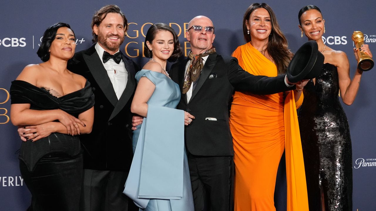 Adriana Paz, from left, Edgar Ramirez, Selena Gomez, Jacques Audiard, Karla Sofia Gascon, and Zoe Saldana pose in the press room with the award for best motion picture - musical or comedy for "Emilia Perez" during the 82nd Golden Globes on Sunday at the Beverly Hilton in Beverly Hills, Calif. (AP Photo/Chris Pizzello)