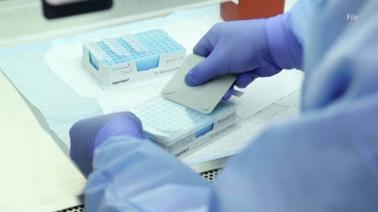 Lab worker testing using a card
