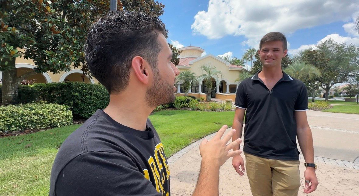 Rosen College of Hospitality Management students Arthur De Paula (left) and John Koprowicz (right) talk about Epic Universe opening May 22. (Spectrum News/Devin Martin)