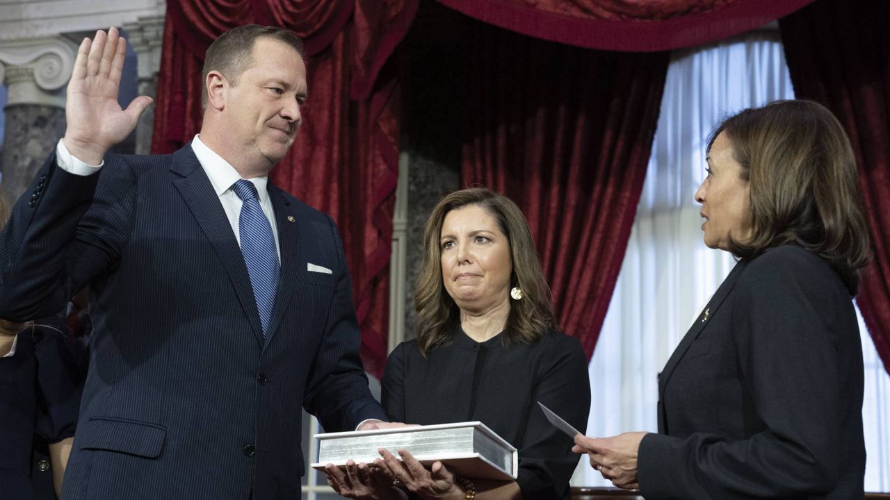 Vice President Kamala Harris participates in a ceremonial swearing-in of Sen. Eric Schmitt, R-Mo., with his wife Jaime Schmitt, center, in the Old Senate Chamber on Capitol Hill in Washington, Tuesday, Jan. 3, 2023. (AP Photo/Jacquelyn Martin)