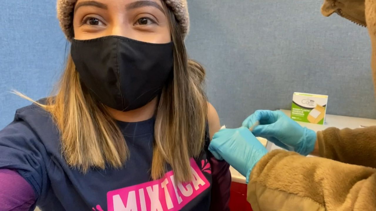 Mixtec organization takes group of workers to vaccinate them