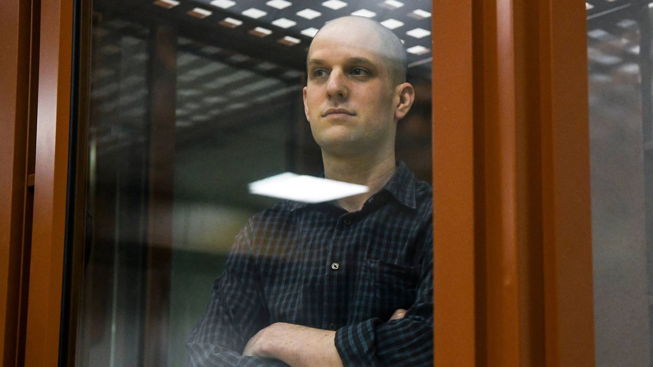 Wall Street Journal reporter Evan Gershkovich stands in a glass cage in a courtroom in Yekaterinburg, Russia, Wednesday, June 26, 2024. (AP Photo)