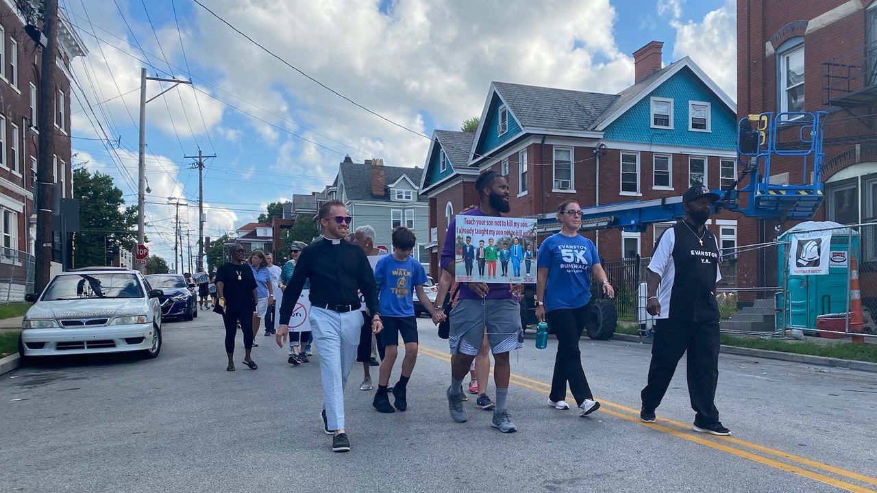 The marchers included residents, faith leaders, police officers and other neighborhood stakeholders. (Casey Weldon/Spectrum News 1)