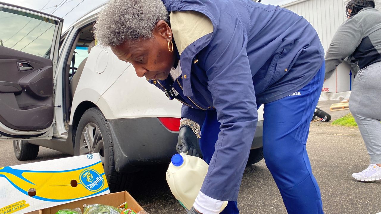 Everlean Abernathy enjoys delivering grocery bundles to people in Louisville’s West End. It’s a chance for her to meet and talk to people in her neighborhood. (Spectrum News 1/Ashley N. Brown)