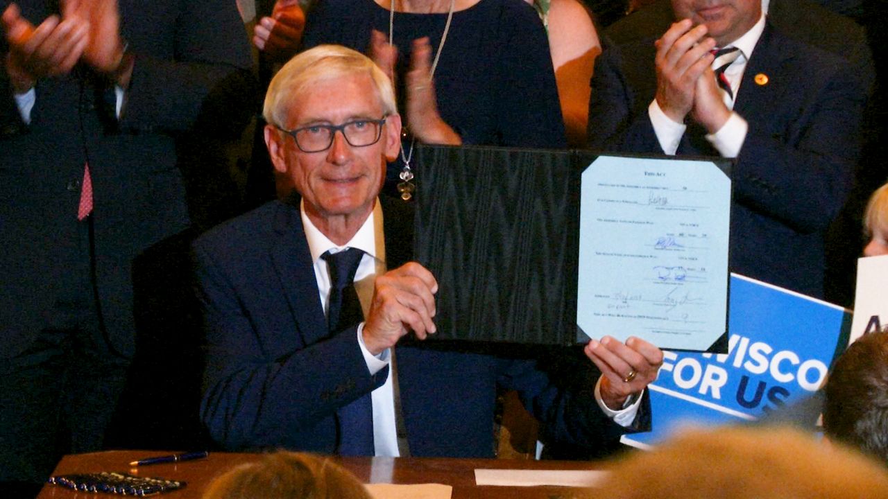 Gov. Tony Evers signs two-year budget into law.
