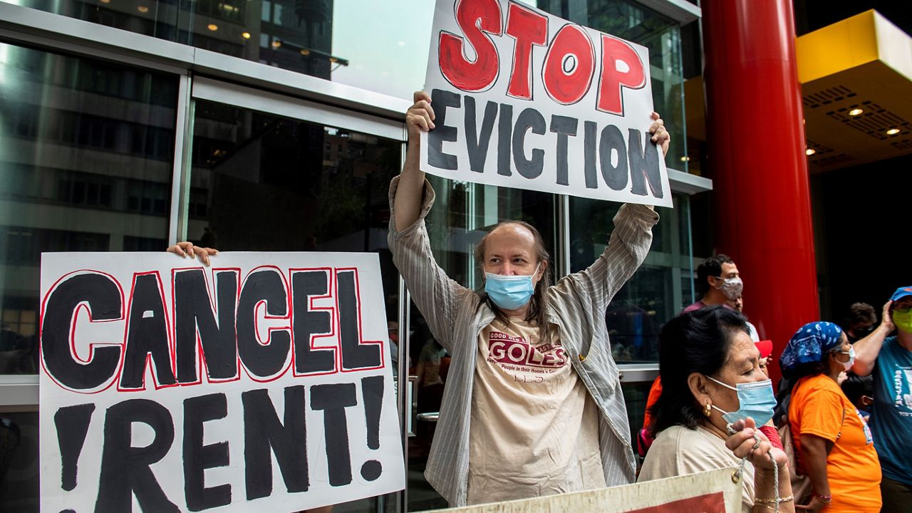 Housing advocates protest on the eviction moratorium in August in New York. (AP/Brittainy Newman)