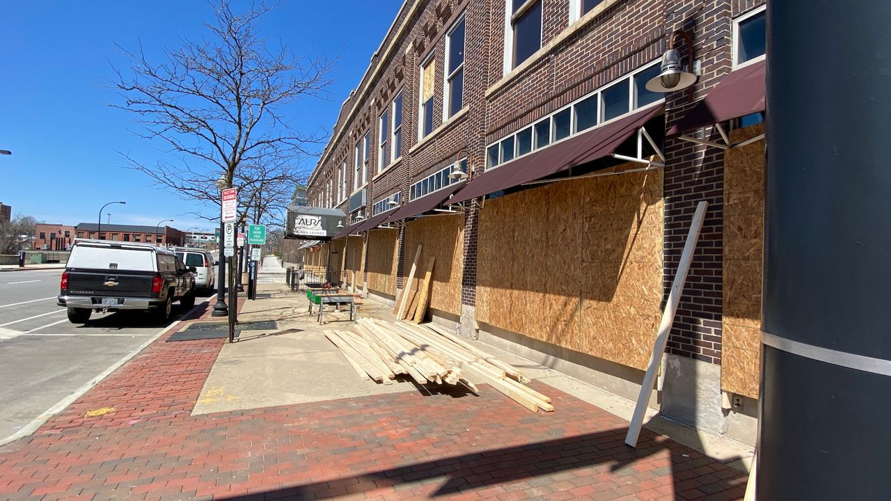 Businesses along Exchange Street in downtown Akron are boarded ahead of anticipated protests in the Jayland Walker case.(Spectrum News 1/Jennifer Conn)
