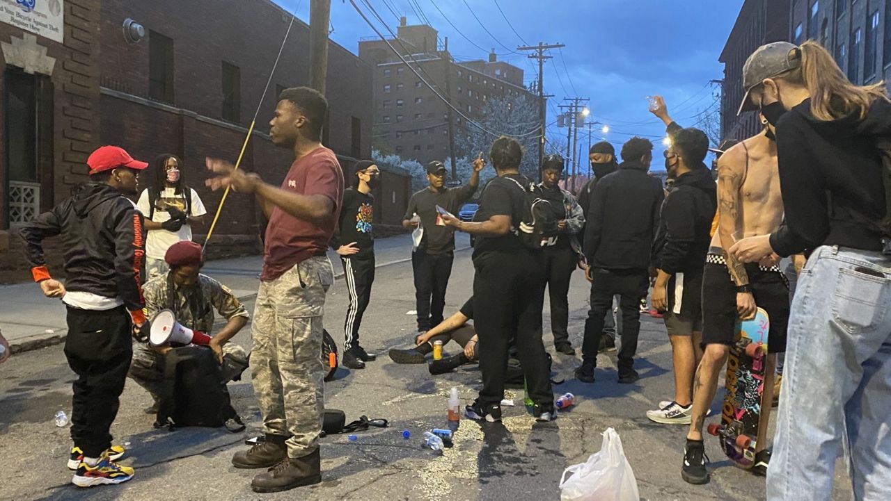 A group of protesters clashed with police officers outside the Albany Police South Station on Wednesday evening. 