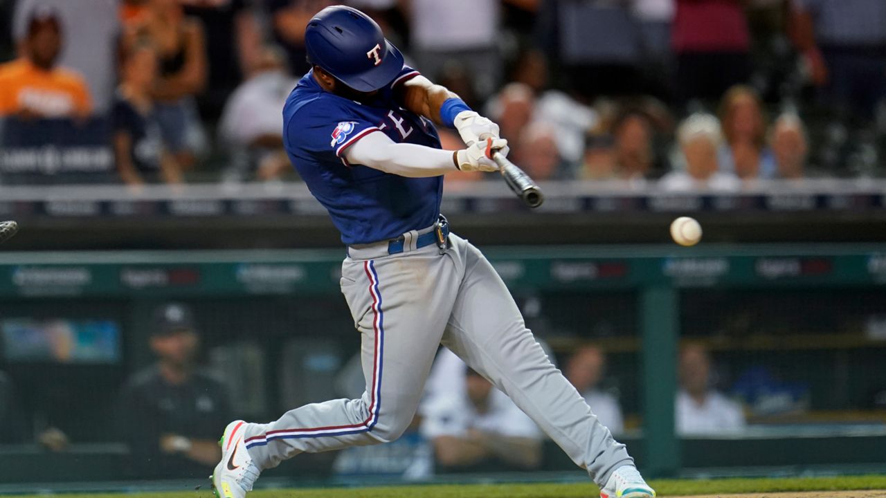 Texas Rangers' Ezequiel Duran hits a three-run triple against the Detroit Tigers in the ninth inning of a baseball game in Detroit, Thursday, June 16, 2022. (AP Photo/Paul Sancya)