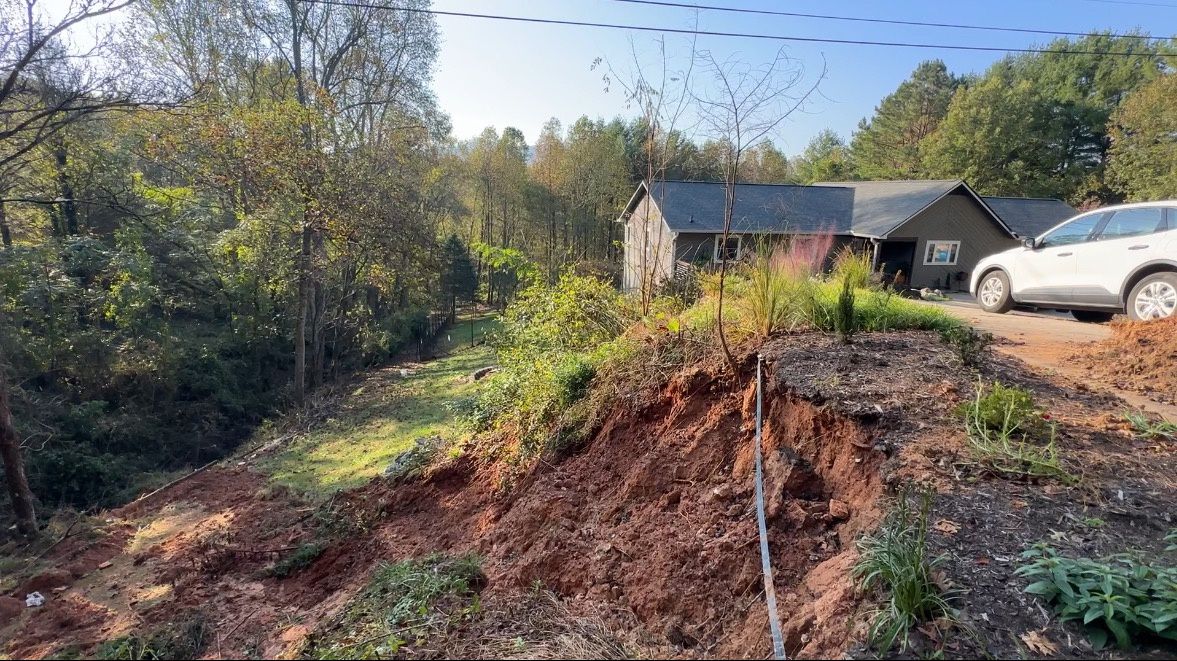 Residents in Fairview, North Carolina are trying to piece their community back together after flooding from Helene caused damage to homes and roads in the area. (Spectrum News 1/Claudia Puente)