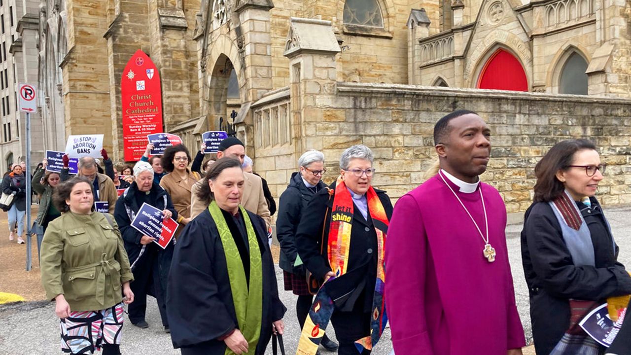 Clergy who filed suit seeking to overturn Missouri’s abortion law and other opponents of the law hold a March through downtown St. Louis on Thursday, Jan. 19, 2023. The suit says Missouri legislators invoked their religious beliefs while drafting the law in violation of the Missouri Constitution. (AP Photo/Jim Salter)