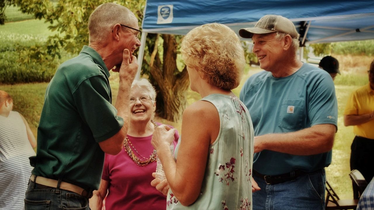 family and friends gathering and smiling