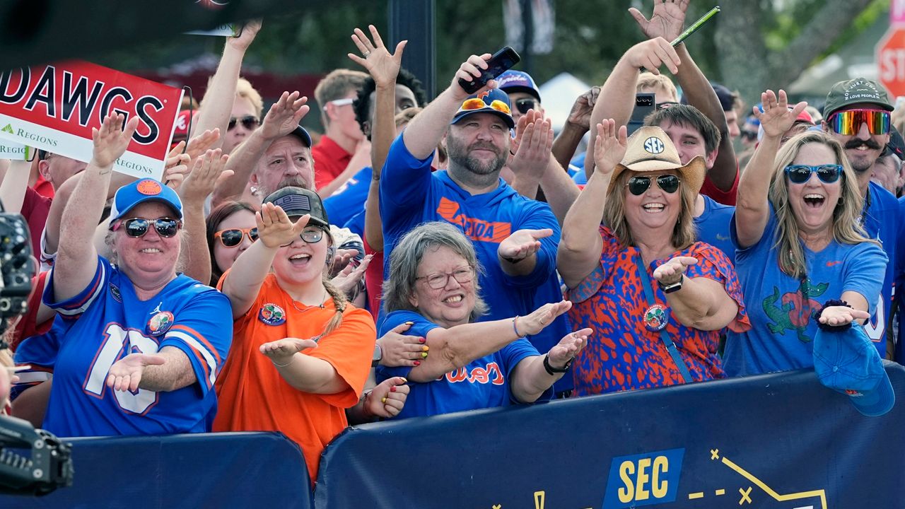 Florida fans cheer outside the stadium before the Florida-Georgia game in Jacksonville on Saturday, Nov. 2, 2024, but deputies got into altercations with fans during the game. (AP Photo/John Raoux)