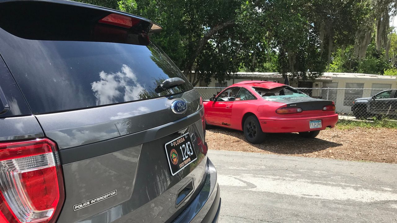 Investigators believe this 1995 Mazda MX-6 was involved in a fatal hit-and-run crash early Sunday in Spring Hill. (Florida Highway Patrol)