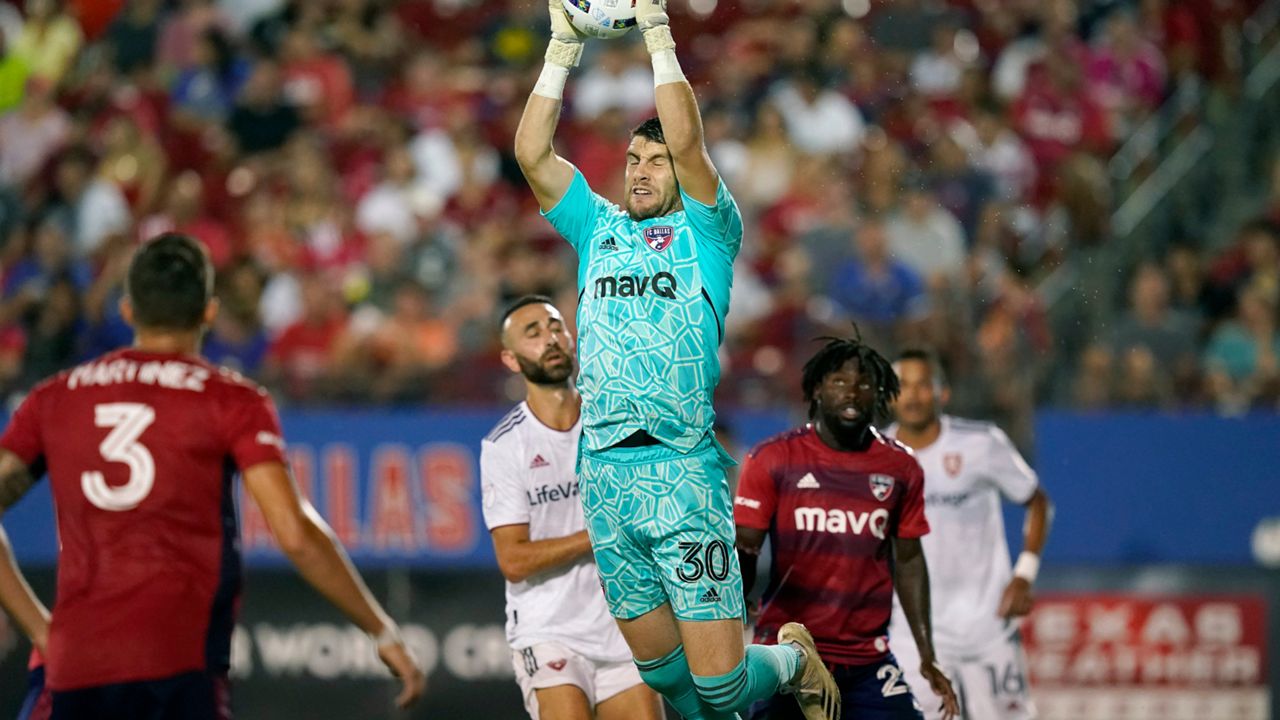 FC Dallas goalkeeper Maarten Paes grabs the ball for a save during the second half of an MLS soccer match against Real Salt Lake Saturday, Aug. 27, 2022, in Frisco, Texas. The teams played to a 1-1 tie. (AP Photo/LM Otero)