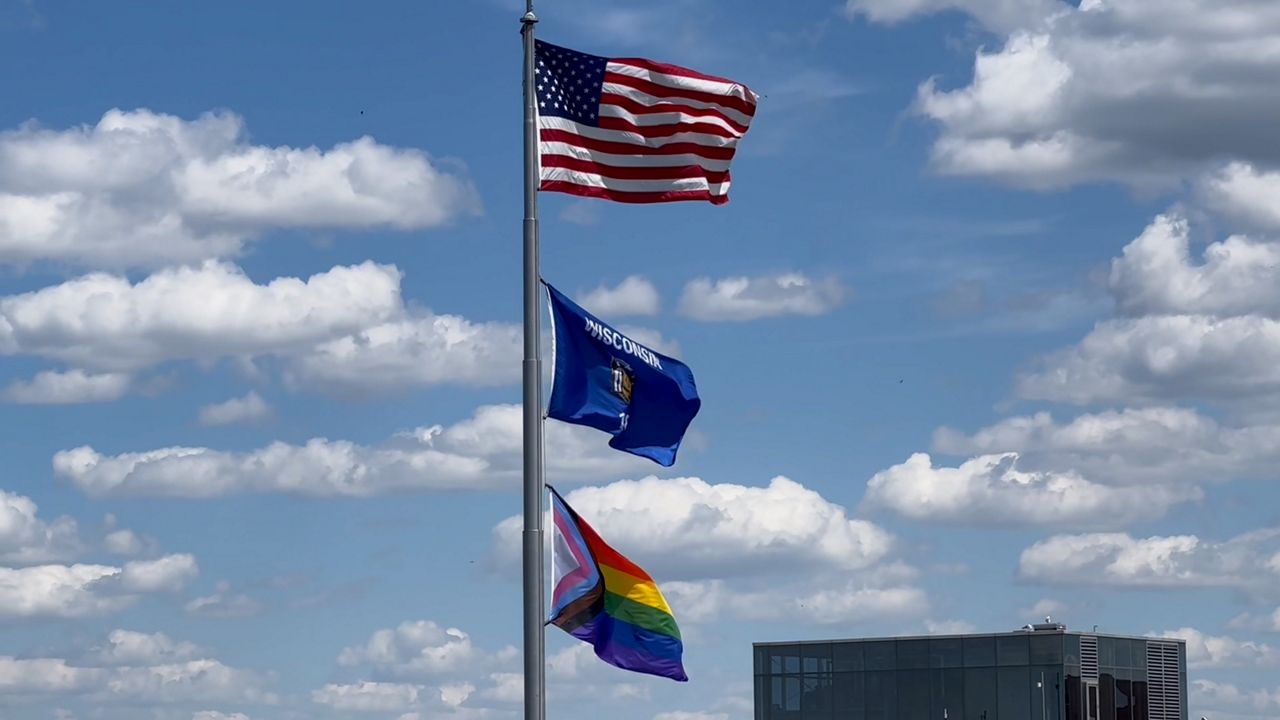 Flags fly over the east wing of the Wisconsin Capitol.
