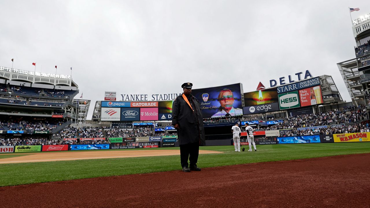 The Yankees hold a moment of silence for FDNY EMS Lt. Alison Russo-Elling before a baseball game against the Orioles on Saturday, Oct. 1, 2022 in New York.