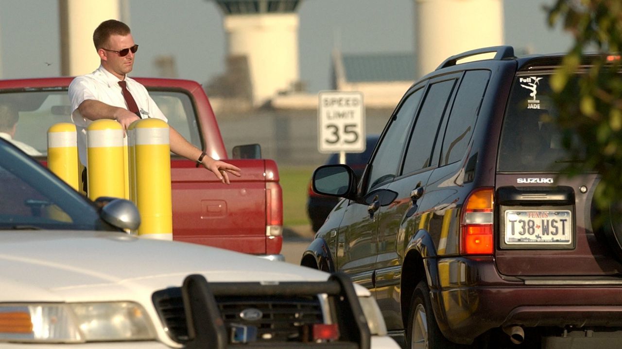 Vehicles are checked as they enter the Federal Bureau of Prisons complex, Wednesday, June 2, 2004 in Beaumont, Texas.Seven inmates have been charged with killing two fellow prisoners and wounding two others during a January, 2022 attack the a federal prison in Texas that led to a nationwide lockdown of the federal prison system a 15-count indictment filed this week said. (AP Photo/David J. Phillip)
