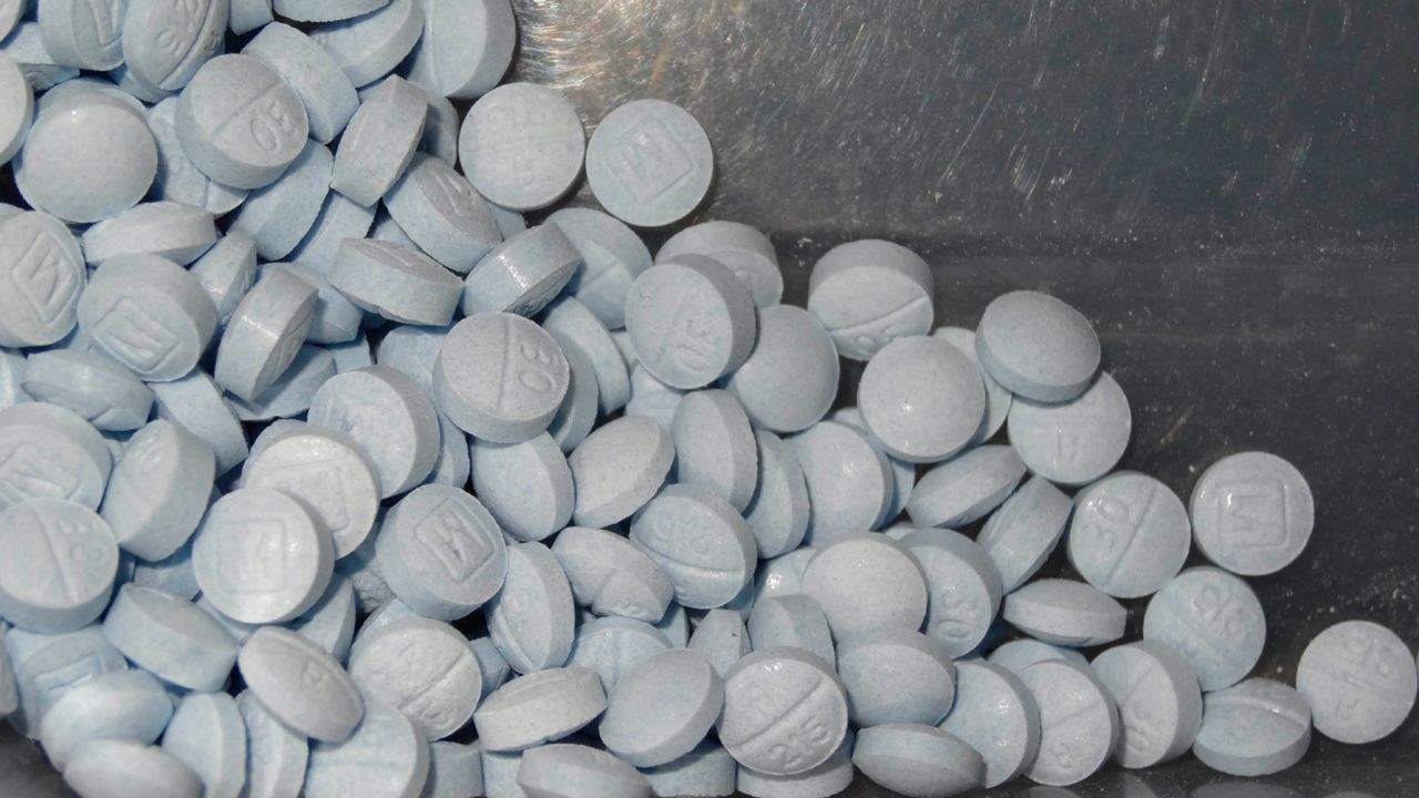 This undated file photo provided by the U.S. Attorneys Office for Utah and introduced as evidence at a trial shows fentanyl-laced fake oxycodone pills collected during an investigation. (U.S. Attorneys Office for Utah via AP, File)