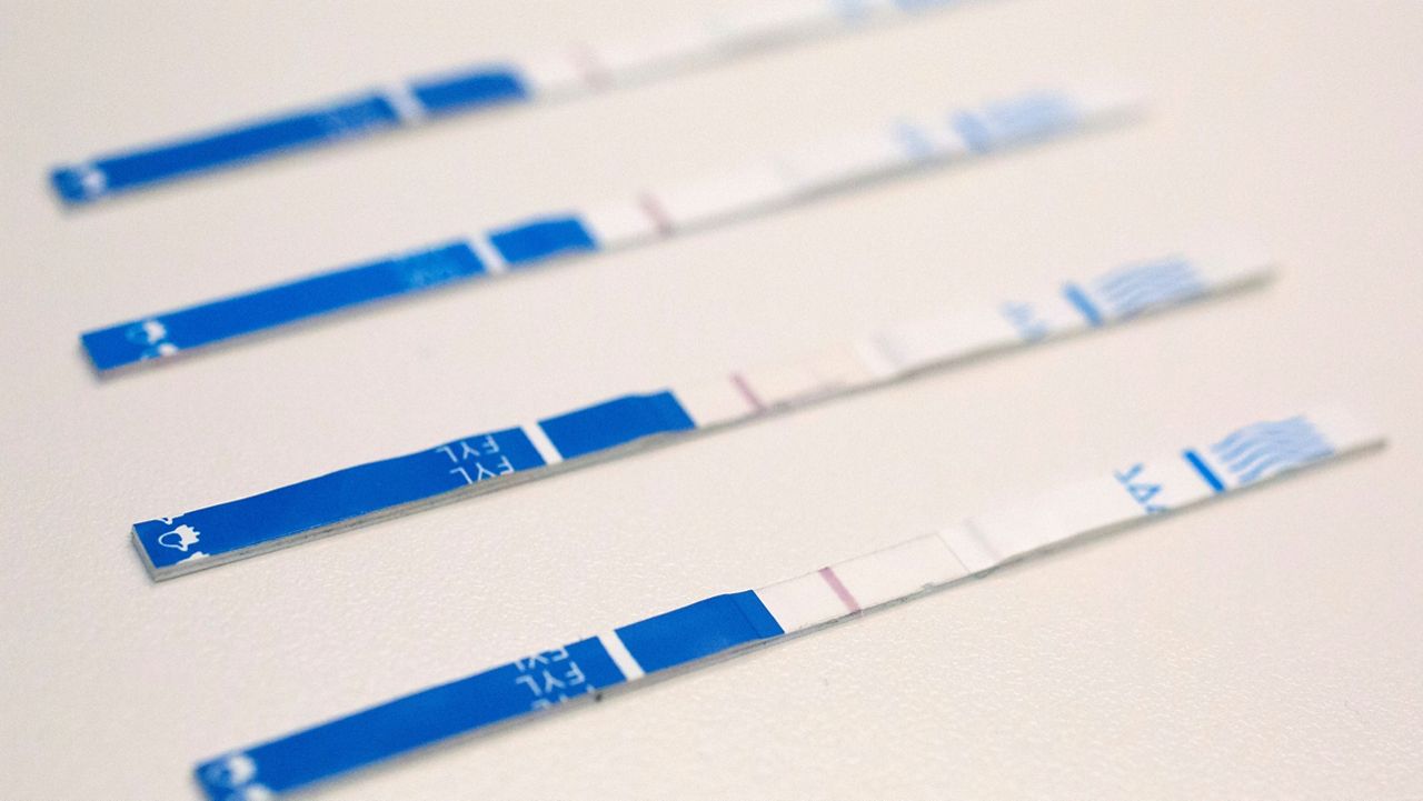 An arrangement of fentanyl test strips. (AP Photo/Mark Lennihan, File)