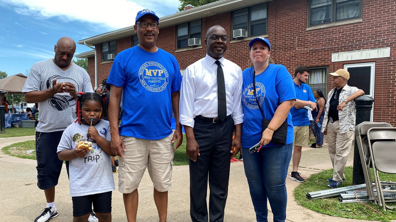 John V. Elmore, Esq. with Buffalo Mayor Byron Brown and Mia Ayers-Goss, executive director of Most Valuable Parents