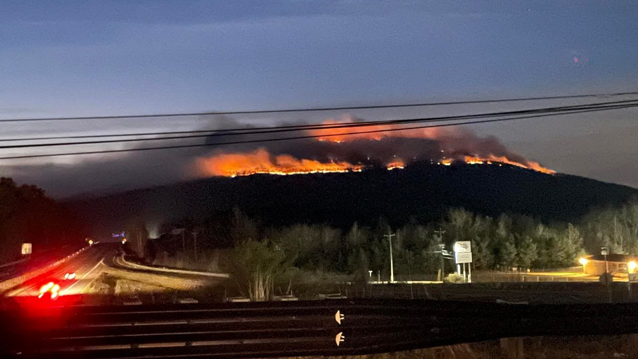 Crews are working to put out a wildfire on Pilot Mountain (Credit: Davis Mathis)