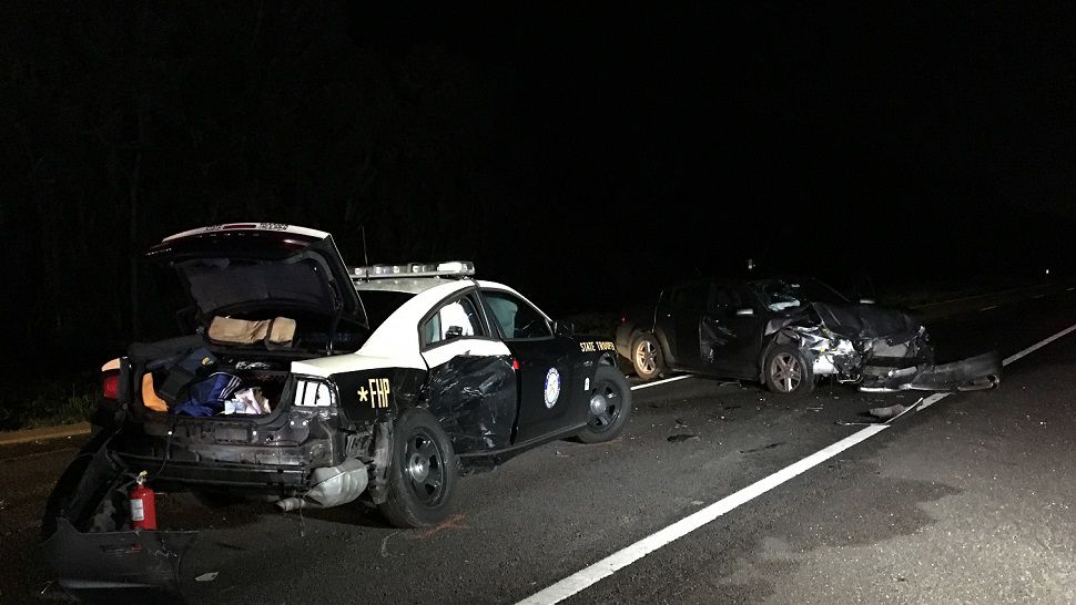 A Florida Highway Patrol trooper was critically injured in a crash on State Road 60 overnight. Authorities said a driver slammed into his cruiser, despite posted signs and the cruiser's lights being on. (Fallon Silcox, staff)