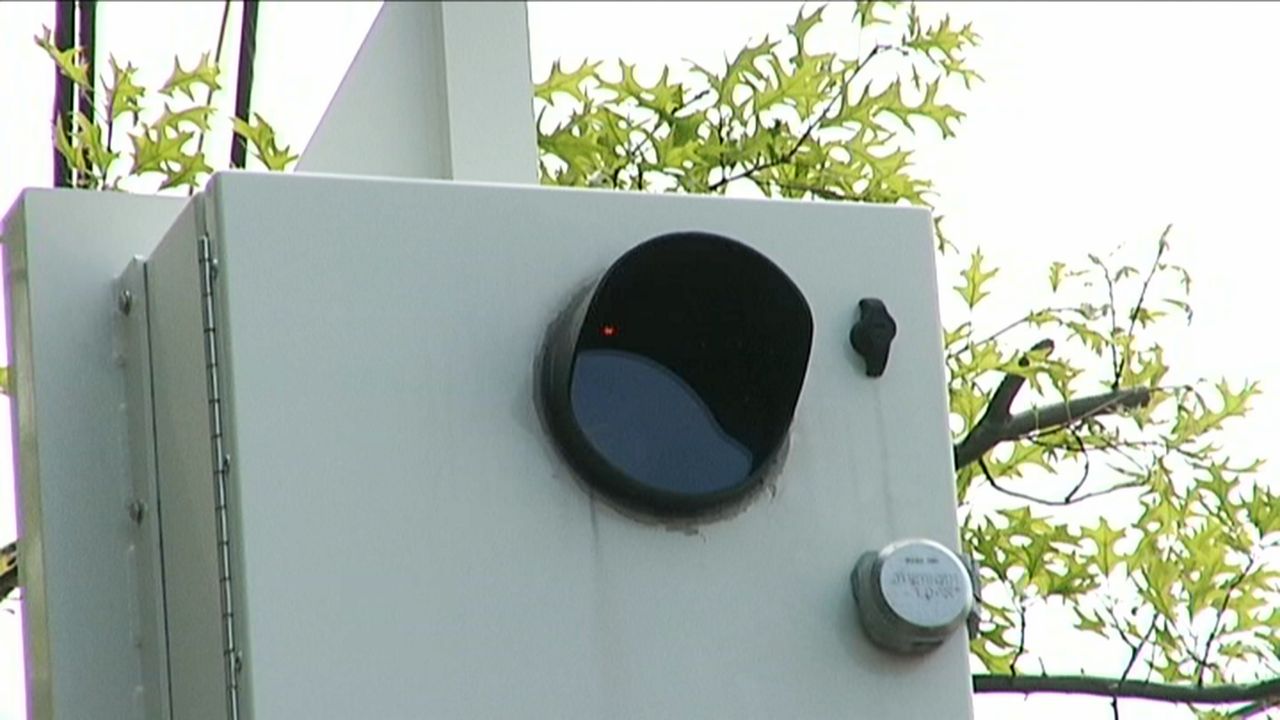 A white speed camera