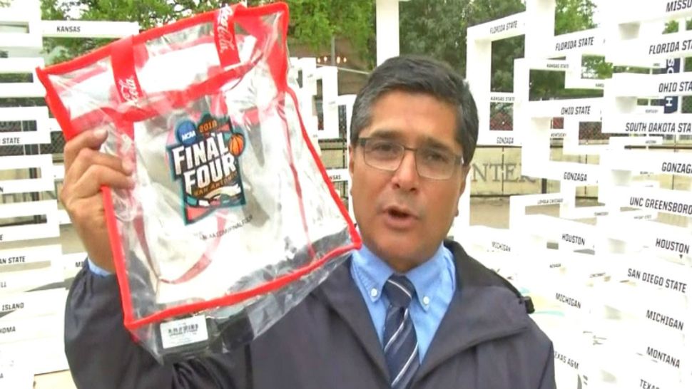Spectrum News reporter John Salazar displays an NCAA-compliant bag in this image from March 26, 2018. (Spectrum News)