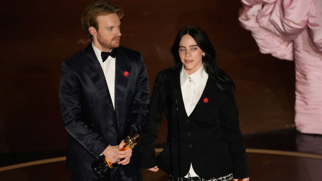 Finneas O'Connell, left, and Billie Eilish accept the award for best original song for "What Was I Made For?" from "Barbie" during the Oscars on Sunday at the Dolby Theatre in Los Angeles. (AP Photo/Chris Pizzello)