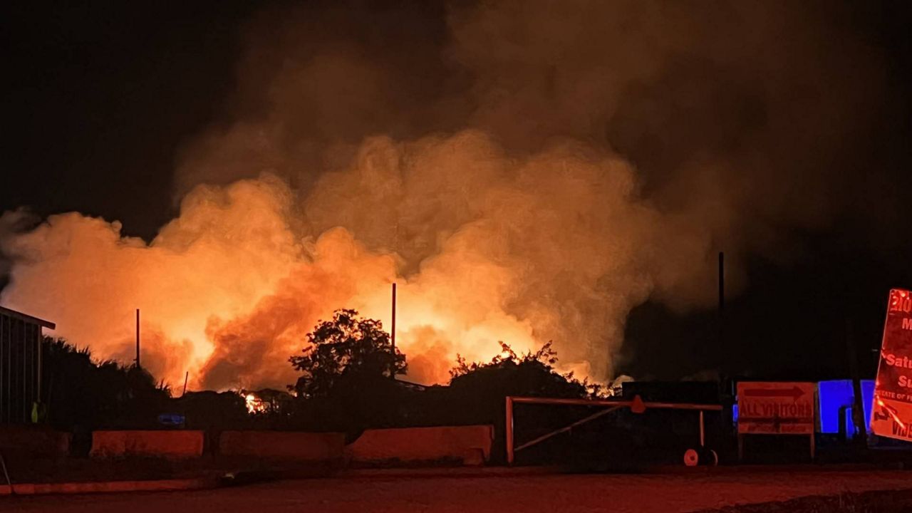 The fire, which started at a recycling facility, has been burning since 3:30 a.m. Officials say that the fire has been contained. (Nicole Griffin/Spectrum News 13)