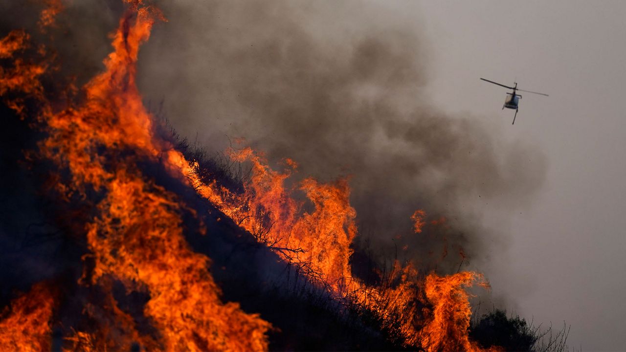 Helicopter fighting the Blue Ridge Fire with water drops