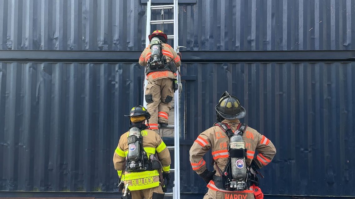 Clayton firefighters conducting a search and rescue training on May 16 at Johnston Community College. (Spectrum News 1/Ashley Van Havere)