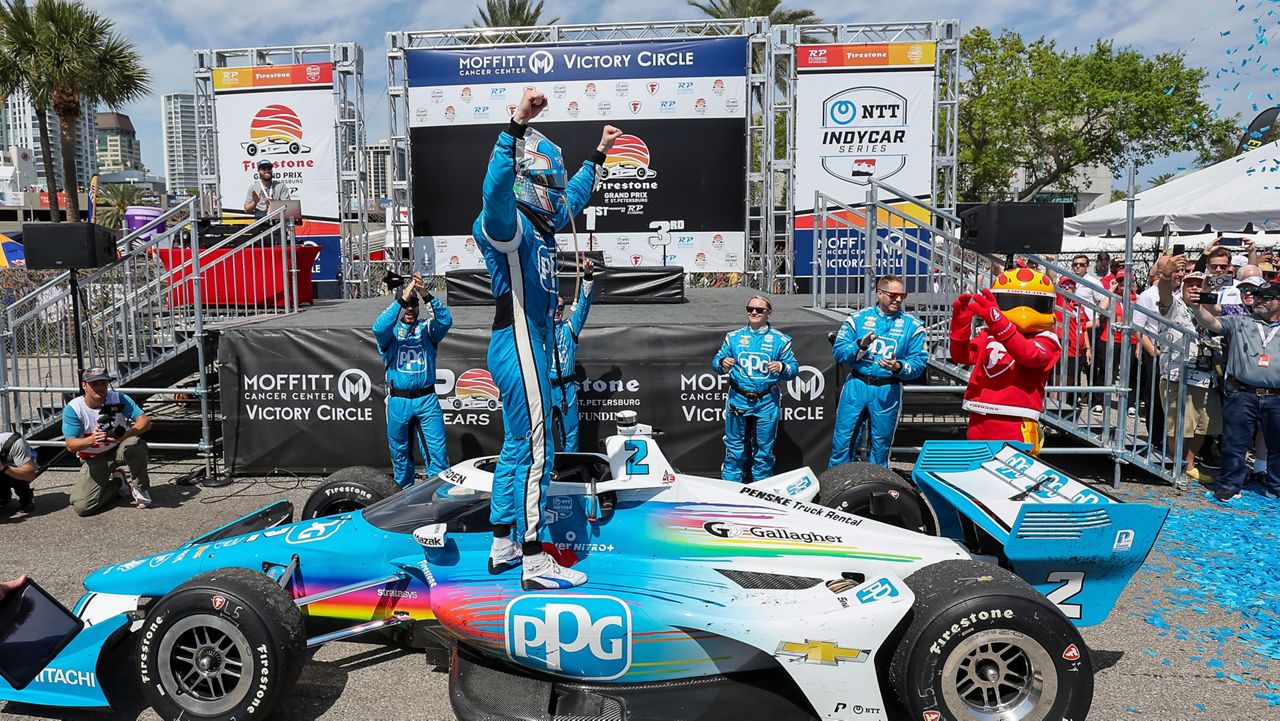 Team Penske driver Josef Newgarden, of the United States, celebrates his win in the IndyCar Grand Prix of St. Petersburg auto race, Sunday, March 10, 2024, in St. Petersburg, Fla. On Wednesday, April 24, IndyCar announced that Newgarden's win is vacated. (AP Photo/Mike Carlson)