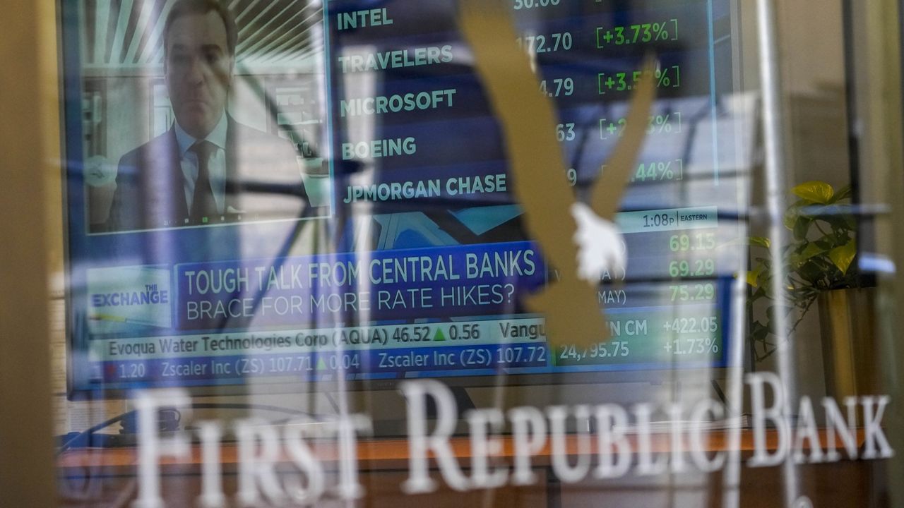 A television screen displaying financial news is seen inside one of First Republic Bank's branches in the Financial District of Manhattan, Thursday, March 16, 2023. (AP Photo/Mary Altaffer)