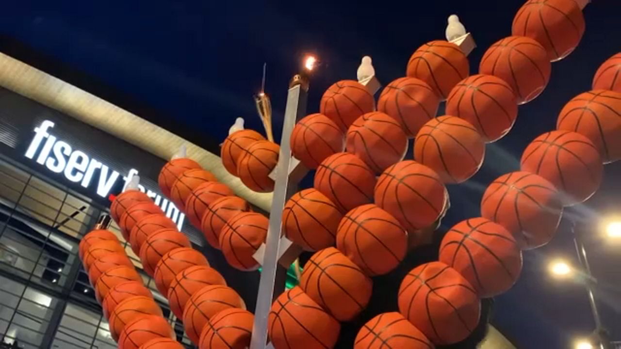 A basketball themed menorah stands outside Milwaukee's Fiserv Forum