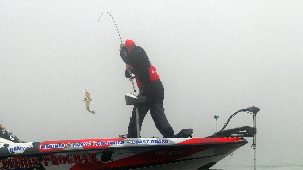 Scott Rook pulls in his first bass of the day after a fog delay during the second day of the Bassmaster Classic in Lake Cataouatche in St. Charles Parish, La., Saturday, Feb. 19, 2011. (AP Photo/Cheryl Gerber)(AP Photo/Cheryl Gerber)