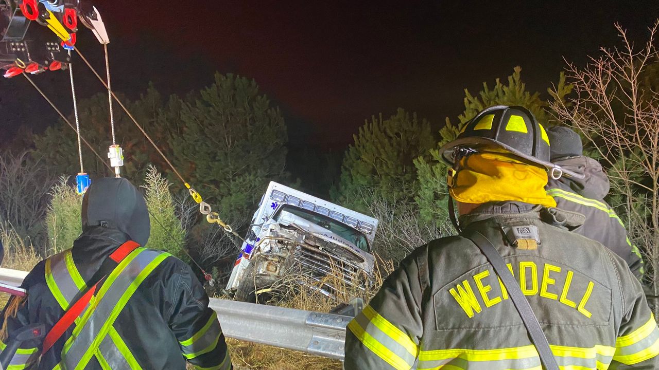 Two Emergency Medical Service (EMS) workers and a patient were rescued after an ambulance went off the road in Knightdale Friday morning.