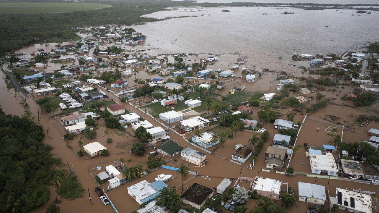 Homes are flooded on Salinas Beach after the passing of Hurricane Fiona in Salinas, Puerto Rico, Monday, Sept. 19, 2022. (AP Photo/Alejandro Granadillo)