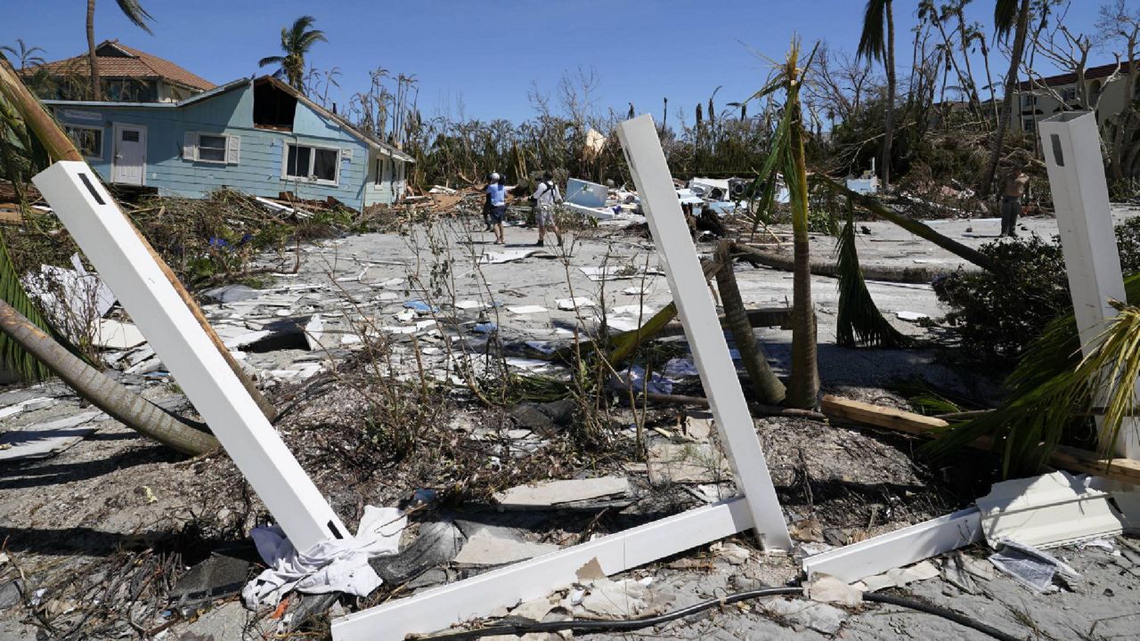 Damged homes are seen, after Hurricane Ian moved through, Friday, Sept. 30, 2022, on Sanibel Island, Fla. (AP Photo/Steve Helber)