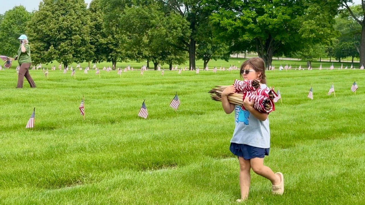 Volunteers pick up 63,000 flags at Dayton National Cemetery
